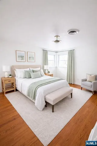 a bedroom with a bed and a couch