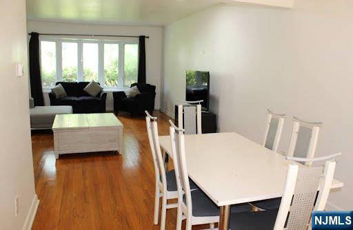 10 Center Street Cresskill, NJ 07626 - Photo 4 of 8 a view of a dining room with furniture and wooden floor