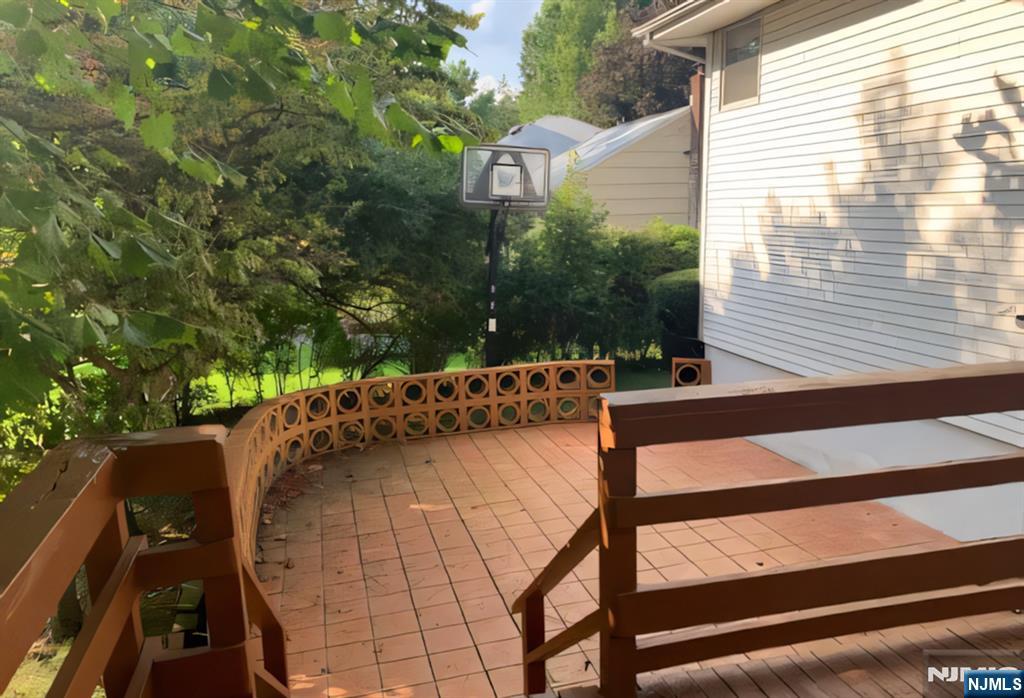 10 Center Street Cresskill, NJ 07626 - Photo 6 of 8 a view of a patio with two chairs and a table