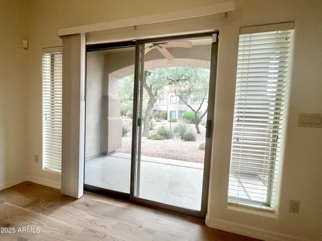 a view of a room that has a large window