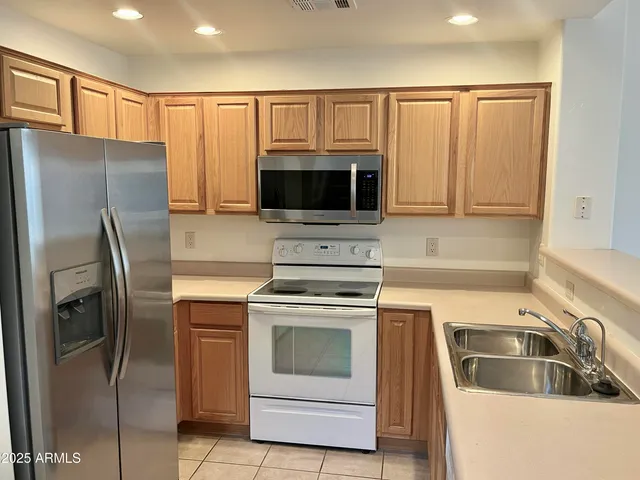 a kitchen with a stove microwave and refrigerator