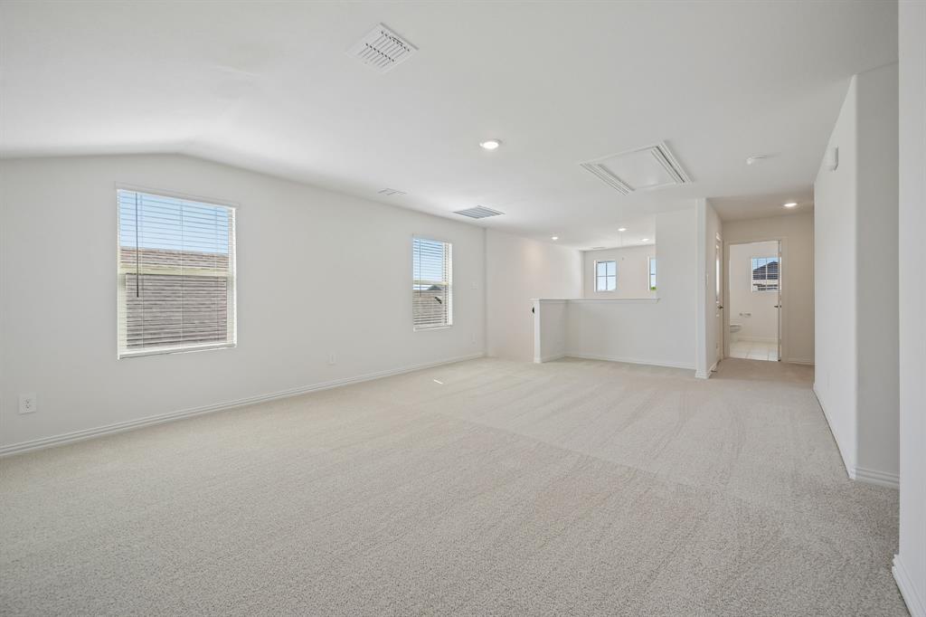 1705 Arches Road Anna, TX 75409 - Photo 26 of 33 an empty room with windows and closet