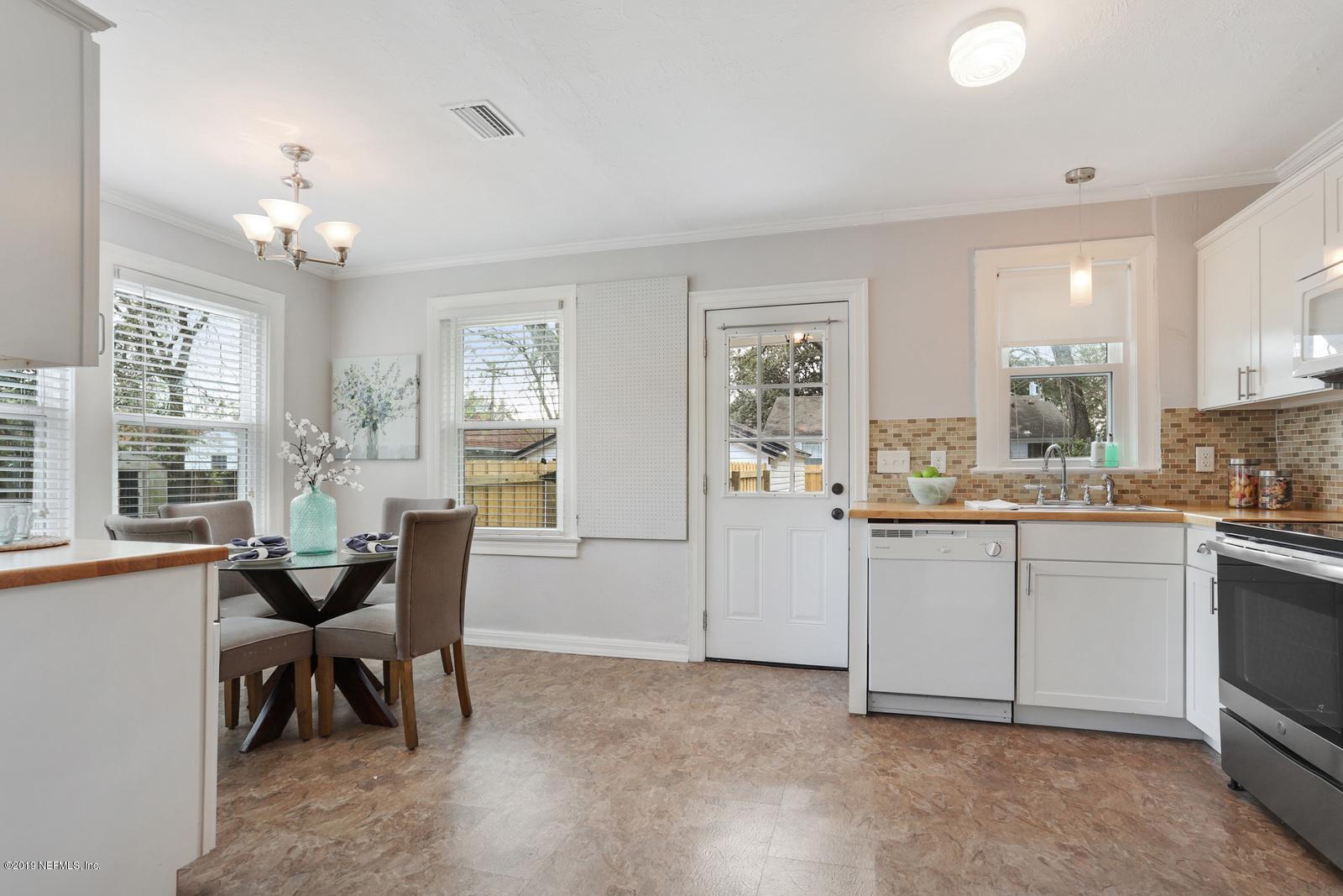 1674 Charon Road Jacksonville, FL 32205 - Photo 4 of 6 a view of a dining room with furniture and a chandelier