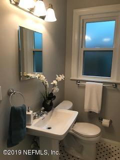 1674 Charon Road Jacksonville, FL 32205 - Photo 6 of 6 a white toilet sitting next to a bathroom sink