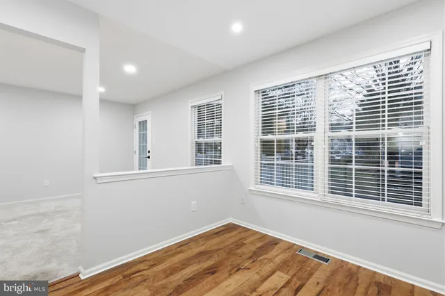 a view of a room with windows