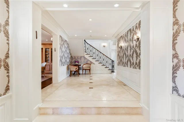 a view of entryway and hall with dining room