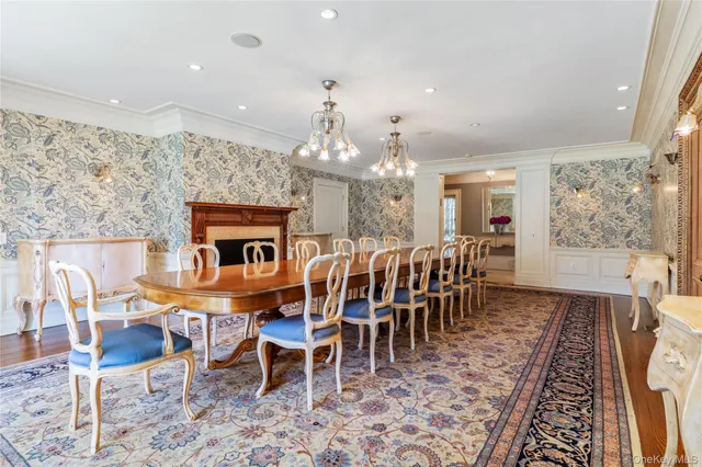 a dining room with furniture a rug and wooden floor