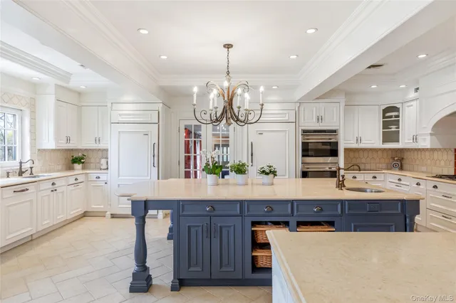 a large kitchen with a counter space cabinets and appliances