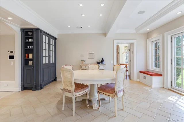 a dining room with furniture and window