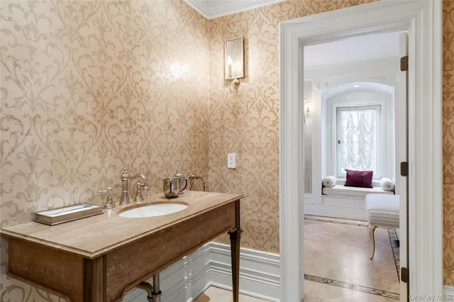 a bathroom with a sink vanity and a mirror