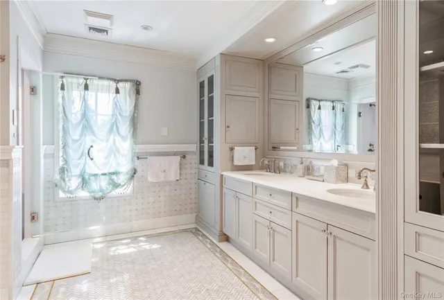 a bathroom with a double vanity sink mirror and double