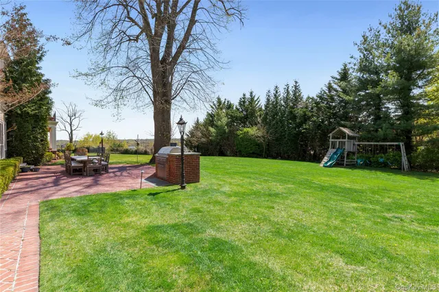 a view of a backyard with sitting area