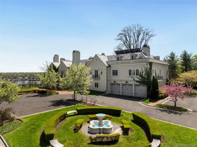 aerial view of a house with swimming pool and a yard