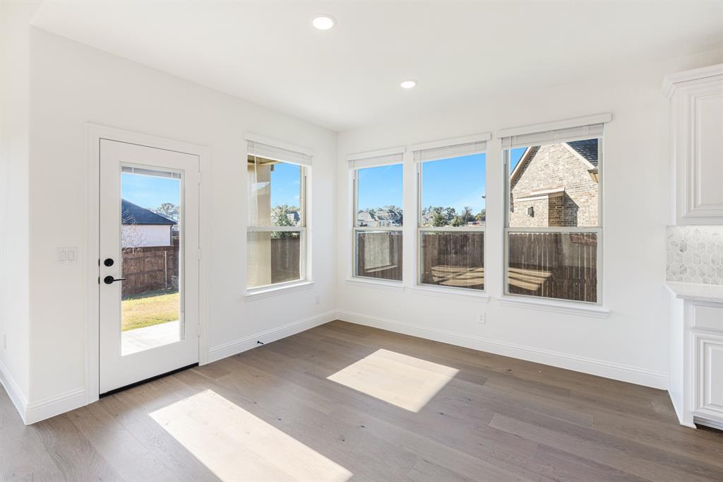 2401 Rileigh Lane Mansfield, TX 76063 - Photo 12 of 40 wooden floor in an empty room with a window