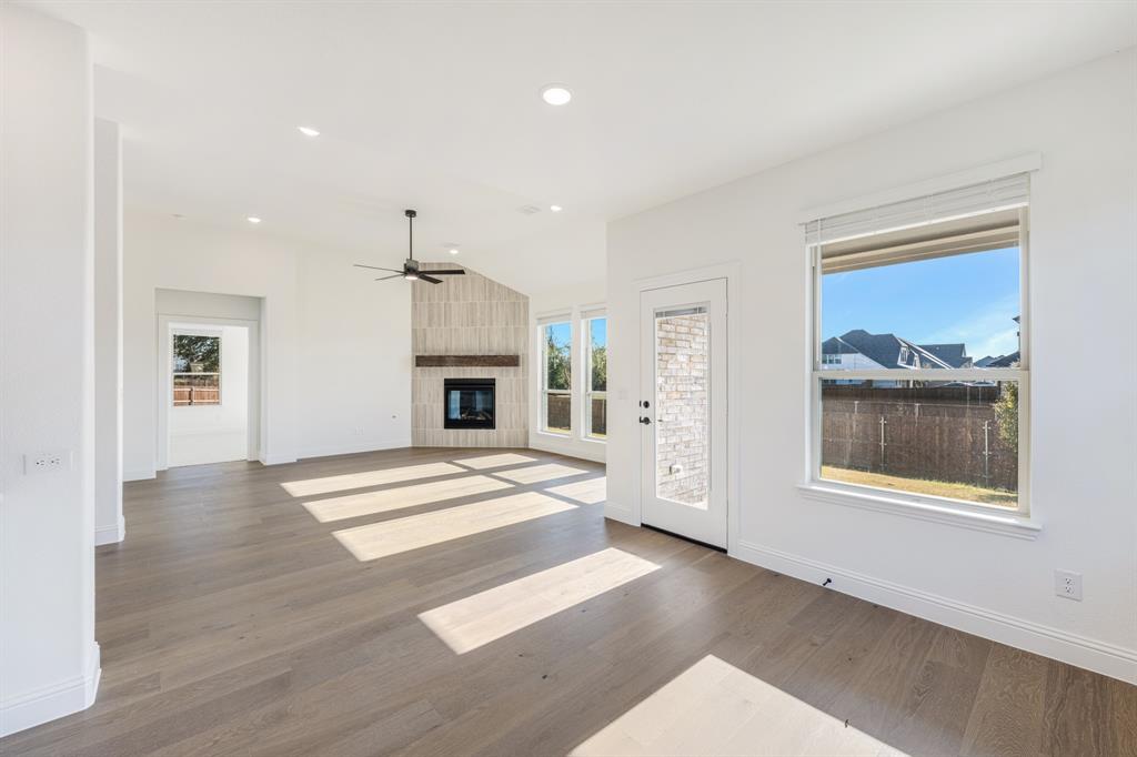 2401 Rileigh Lane Mansfield, TX 76063 - Photo 13 of 40 a view of an empty room with window and fireplace