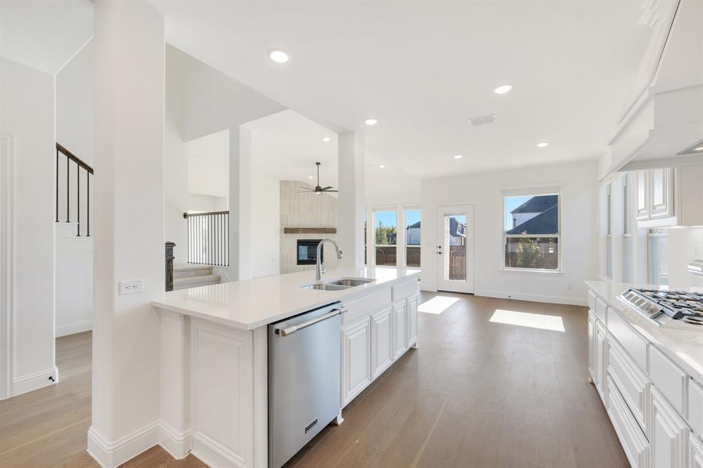 2401 Rileigh Lane Mansfield, TX 76063 - Photo 15 of 40 a large white kitchen with stainless steel appliances