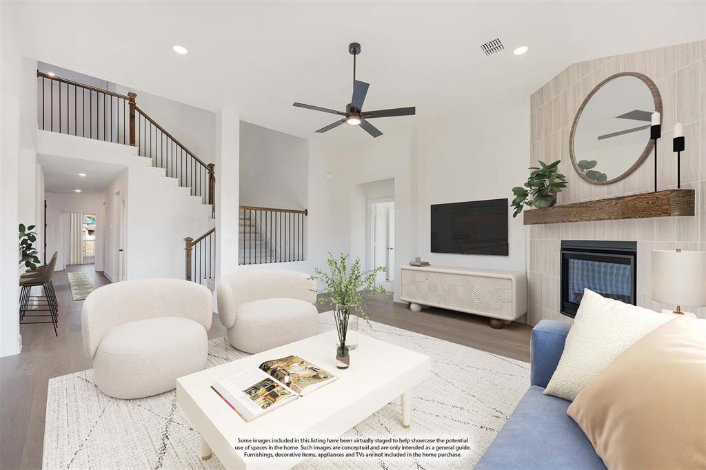 2401 Rileigh Lane Mansfield, TX 76063 - Photo 17 of 40 a living room with furniture a fireplace and a flat screen tv
