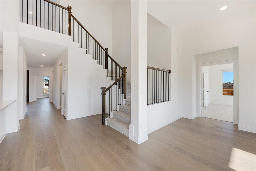 2401 Rileigh Lane Mansfield, TX 76063 - Photo 23 of 40 a view of a hallway with wooden floor and entryway