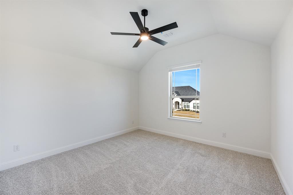 2401 Rileigh Lane Mansfield, TX 76063 - Photo 31 of 40 an empty room with a window and a ceiling fan