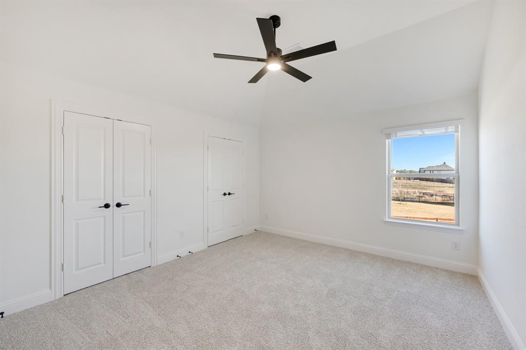2401 Rileigh Lane Mansfield, TX 76063 - Photo 32 of 40 a view of room with hardwood floor and a ceiling fan