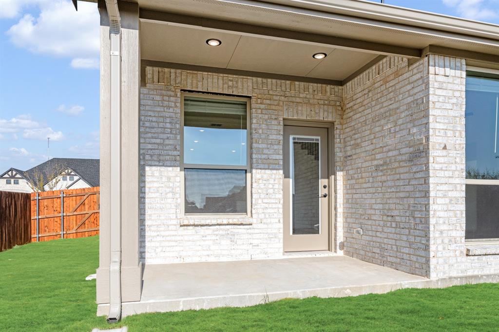 2401 Rileigh Lane Mansfield, TX 76063 - Photo 36 of 40 a front view of a house with a yard