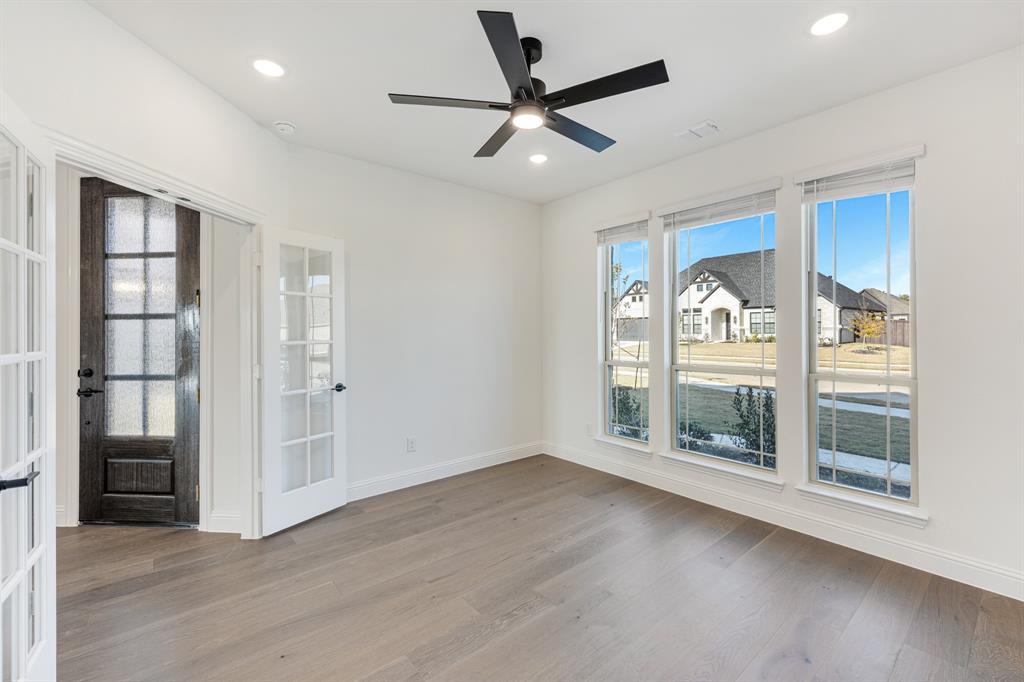 2401 Rileigh Lane Mansfield, TX 76063 - Photo 8 of 40 a view of a livingroom with a ceiling fan and window