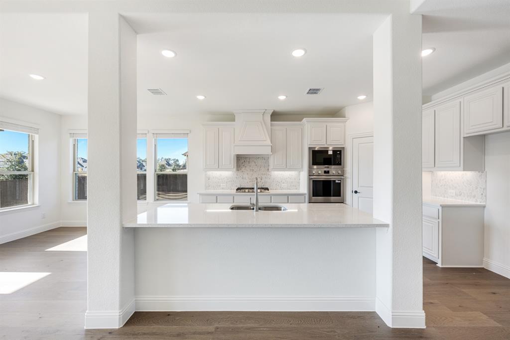 2401 Rileigh Lane Mansfield, TX 76063 - Photo 10 of 40 a view of large kitchen with stainless steel appliances refrigerator sink and cabinets