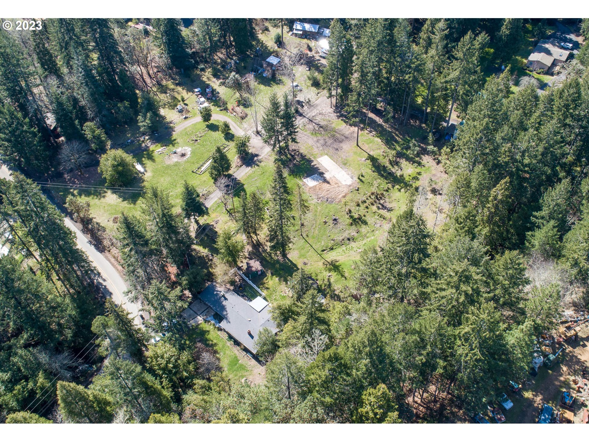 207 Snowberry Road Roseburg, OR 97471 - Photo 13 of 31 a view of a house in a forest