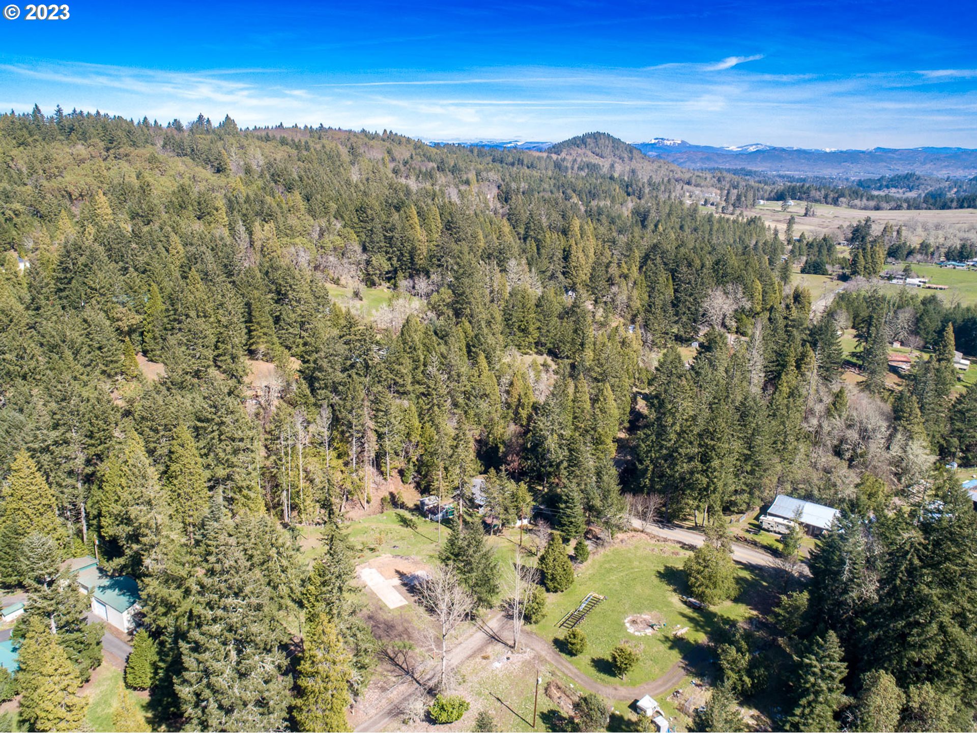 207 Snowberry Road Roseburg, OR 97471 - Photo 16 of 31 a view of a city with mountains in the background