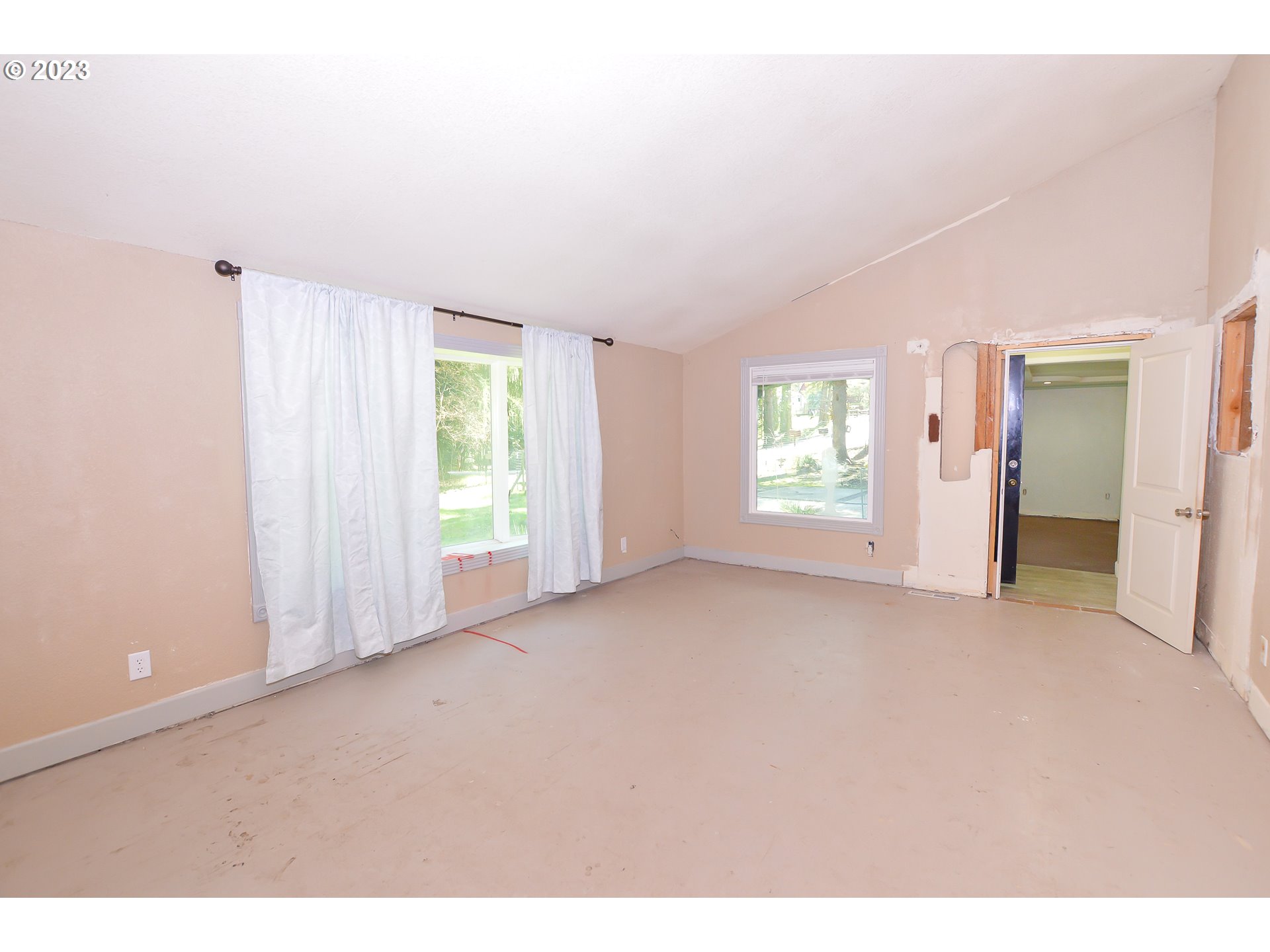 207 Snowberry Road Roseburg, OR 97471 - Photo 23 of 31 a view of an empty room with a window