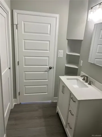 a bathroom with a sink and a mirror