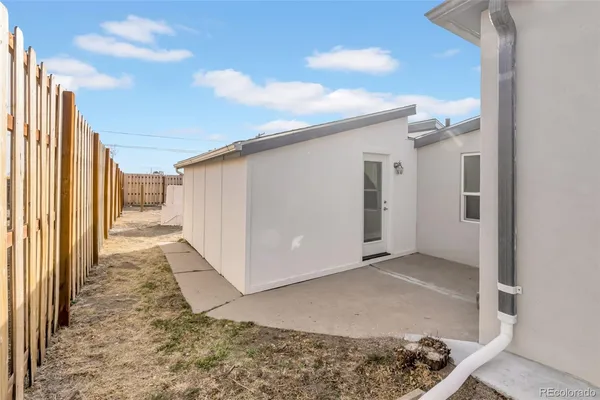 a view of a back yard from a hallway