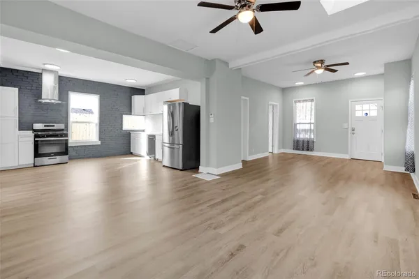 a view of a kitchen with a stove cabinets and wooden floor