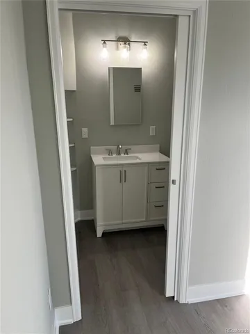 a bathroom with a double vanity sink and mirror
