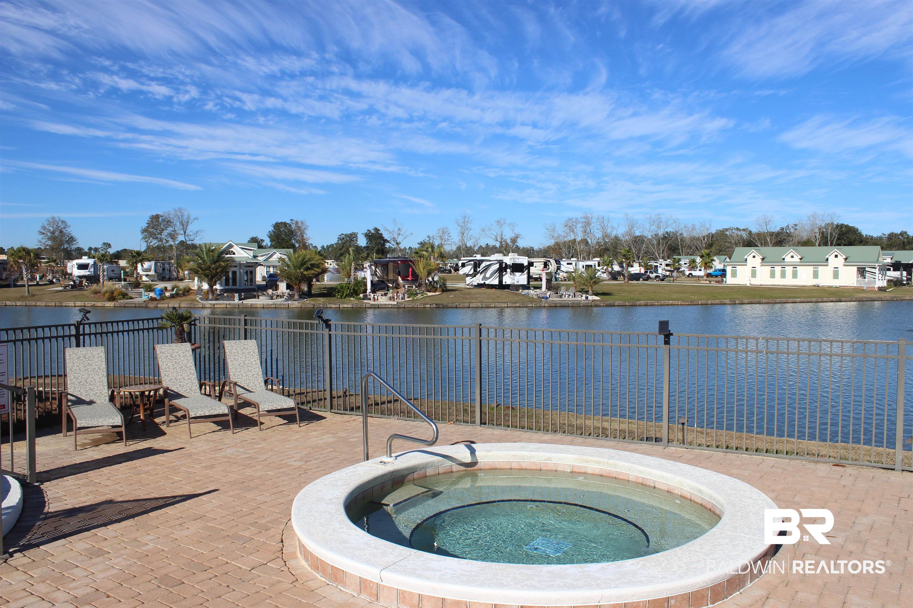11869 Gateway Drive Elberta, AL 36530 - Photo 34 of 78 View of swimming pool featuring fence, a patio area, a water view, and a residential view