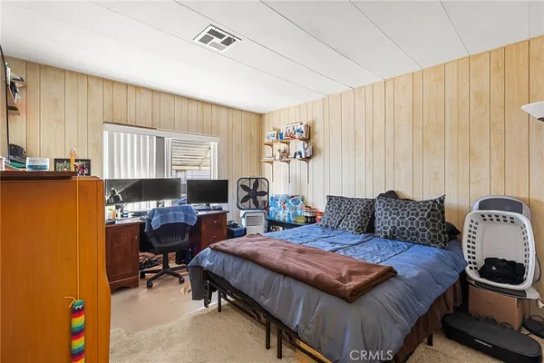 a kitchen with stainless steel appliances granite countertop a stove a sink dishwasher a refrigerator and cabinets with wooden floor