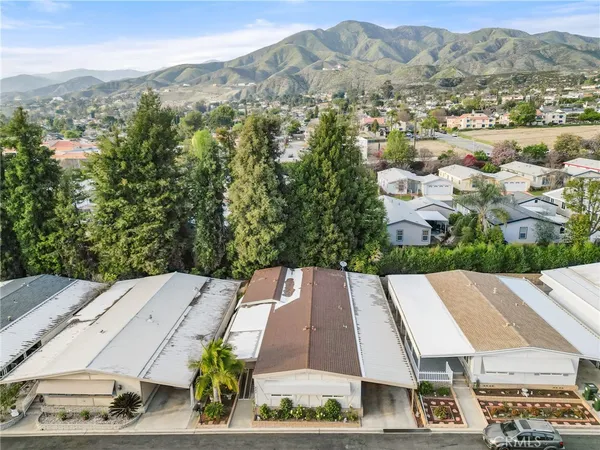 an aerial view of a house with a garden