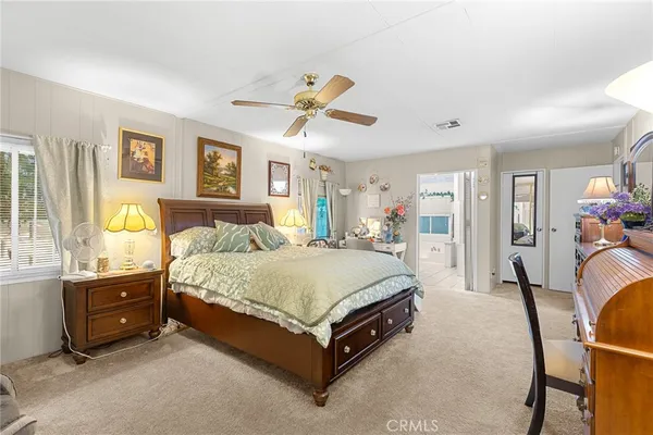 a bathroom with a sink a mirror a bathtub and shower