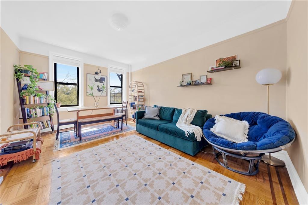 a living room with furniture and a rug