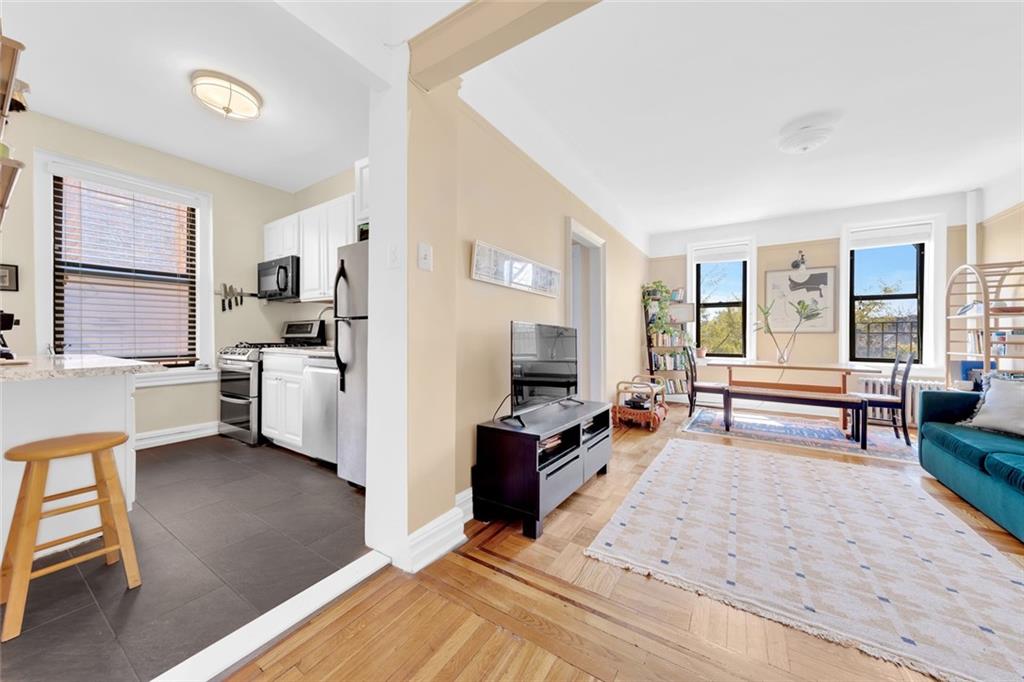255 79th Street, Unit D8 Brooklyn, NY 11209 - Photo 2 of 8 a view of a living room kitchen and a window