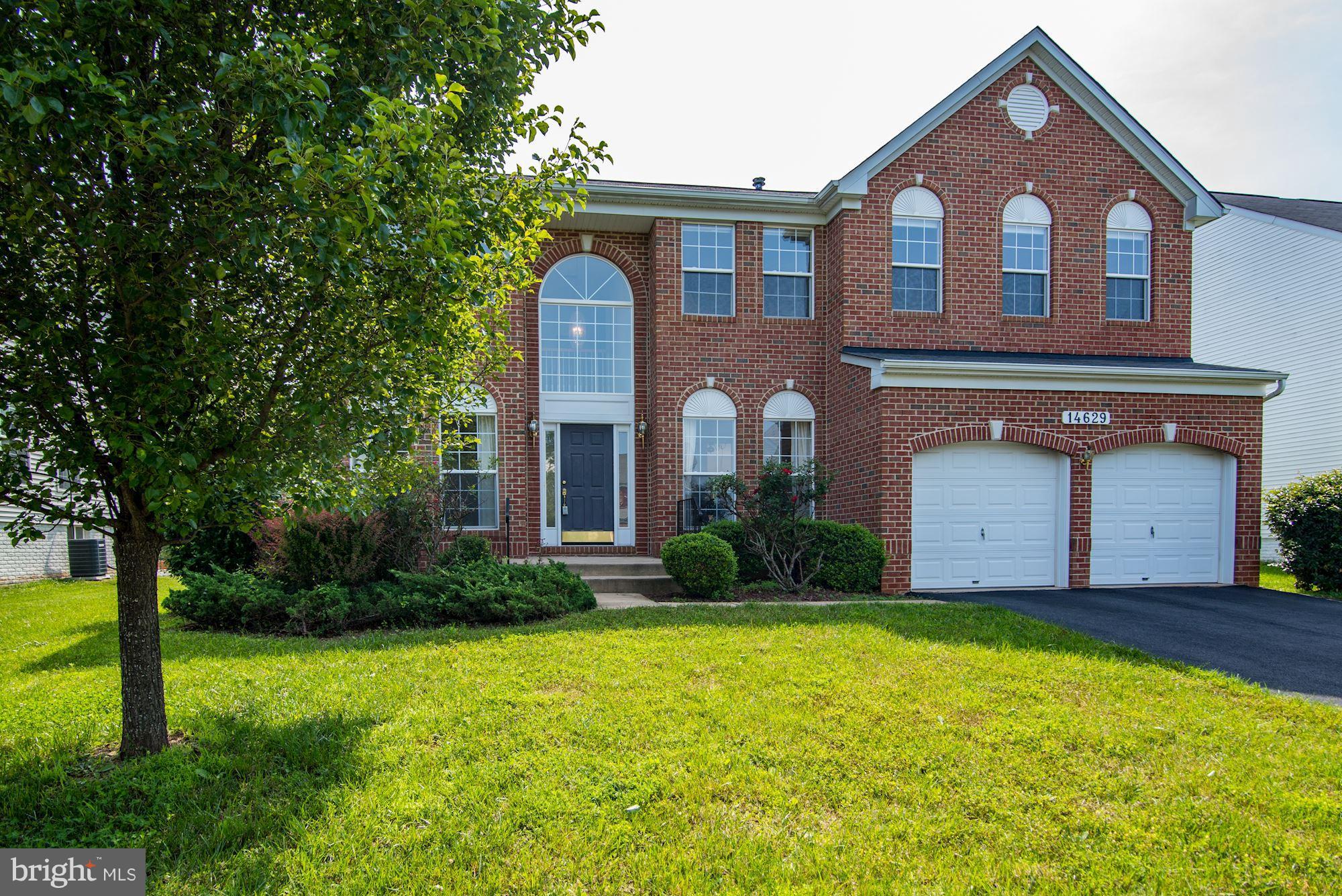 14629 Bubbling Spring Road Boyds, MD 20841 - Photo 1 of 30 a front view of a house with garden
