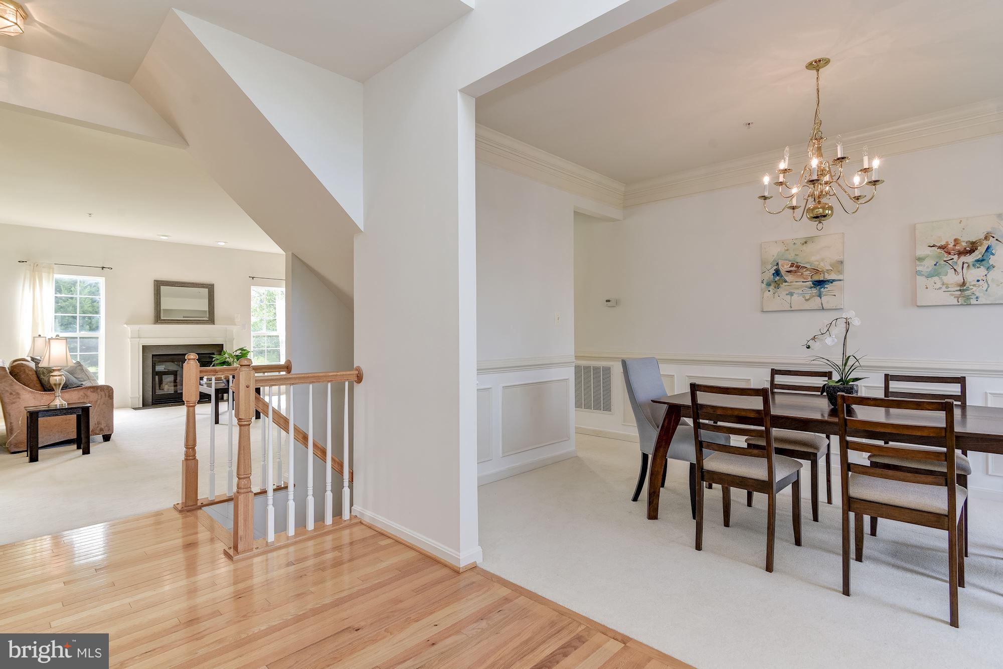 14629 Bubbling Spring Road Boyds, MD 20841 - Photo 3 of 30 a view of a dining room with furniture and wooden floor