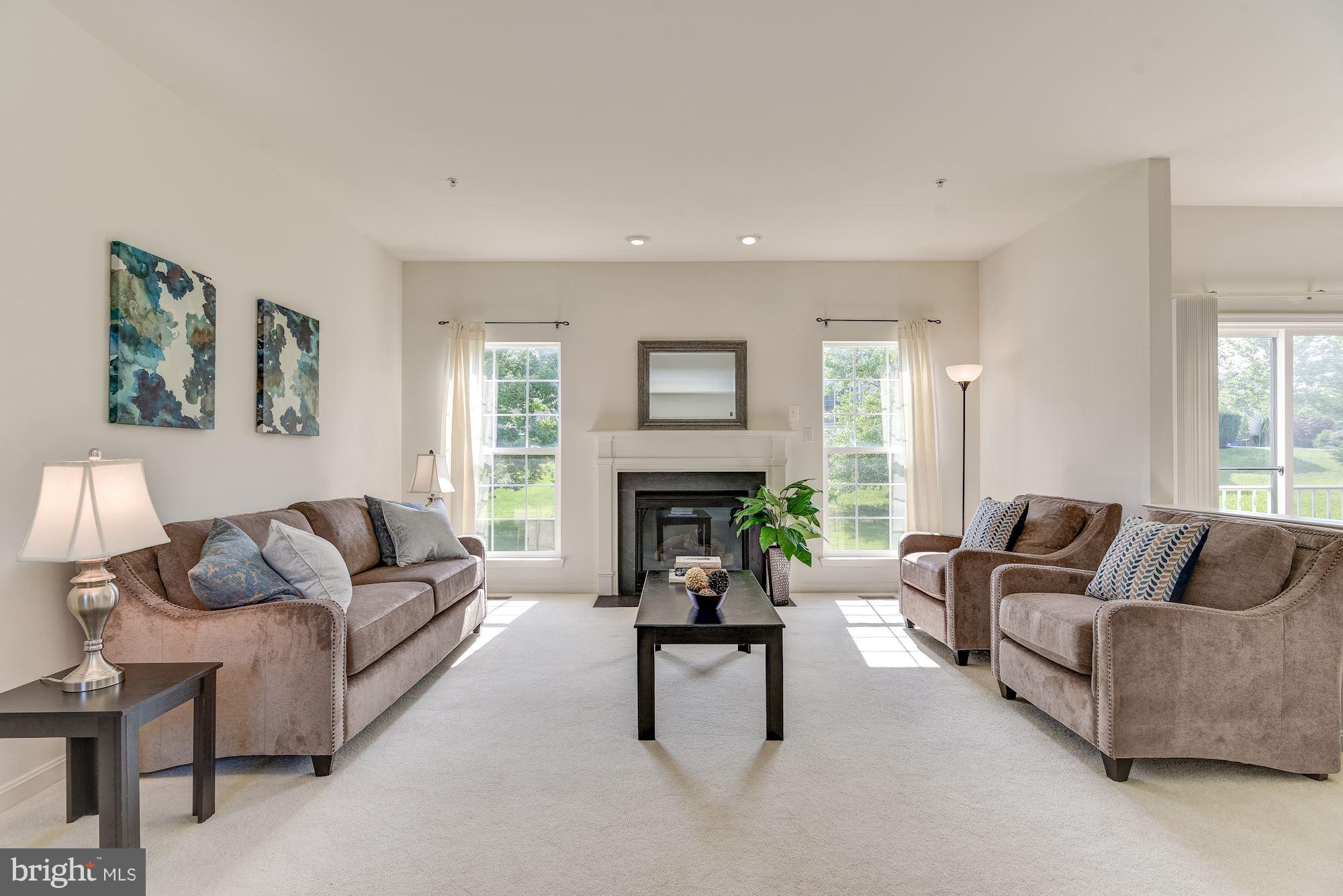 14629 Bubbling Spring Road Boyds, MD 20841 - Photo 4 of 30 a living room with furniture and a fireplace