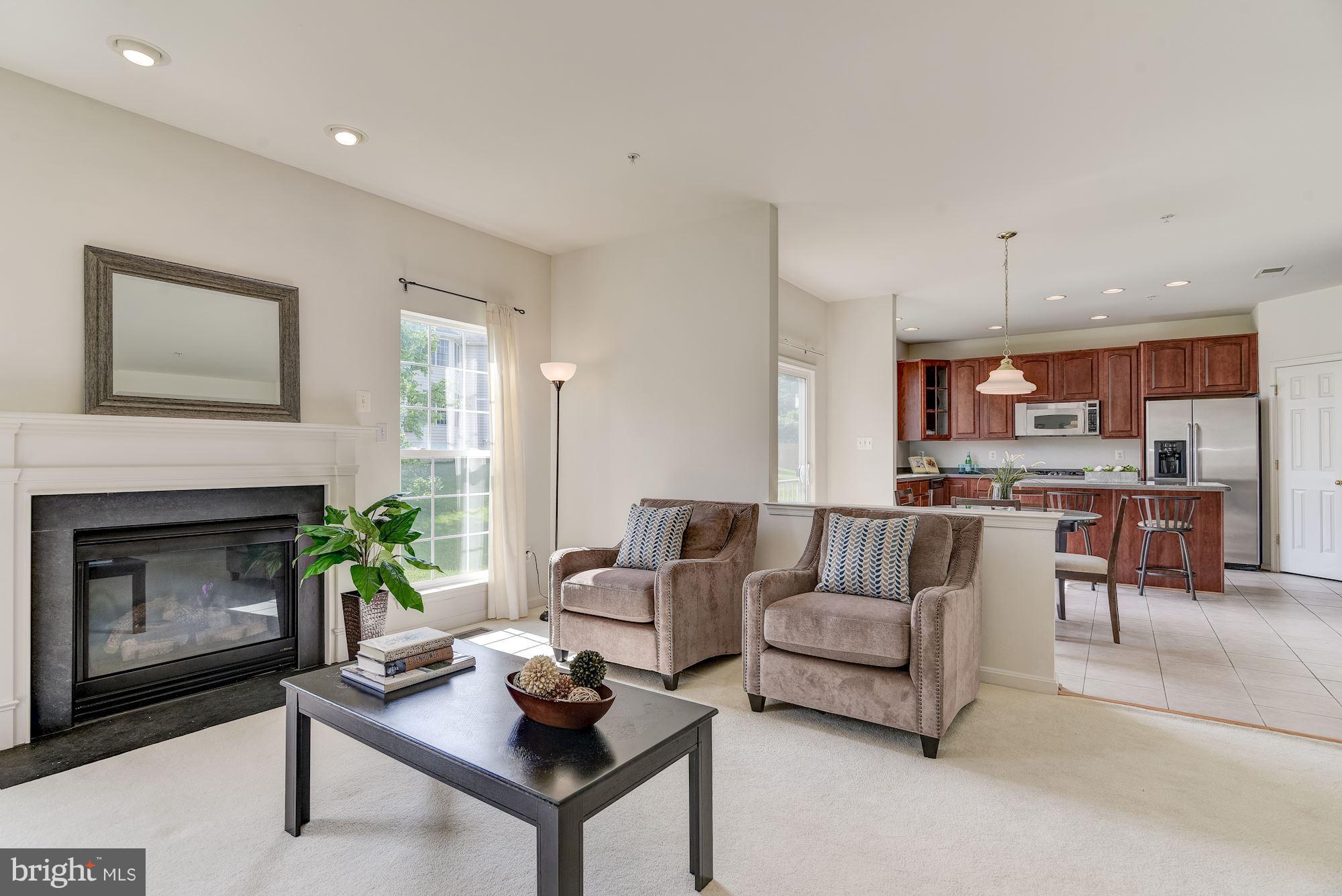 14629 Bubbling Spring Road Boyds, MD 20841 - Photo 5 of 30 a living room with furniture and a fireplace