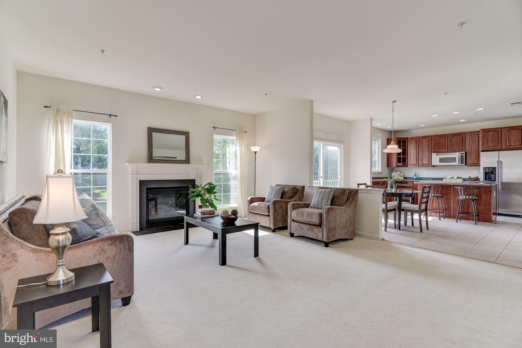 14629 Bubbling Spring Road Boyds, MD 20841 - Photo 6 of 30 a living room with furniture and a fireplace