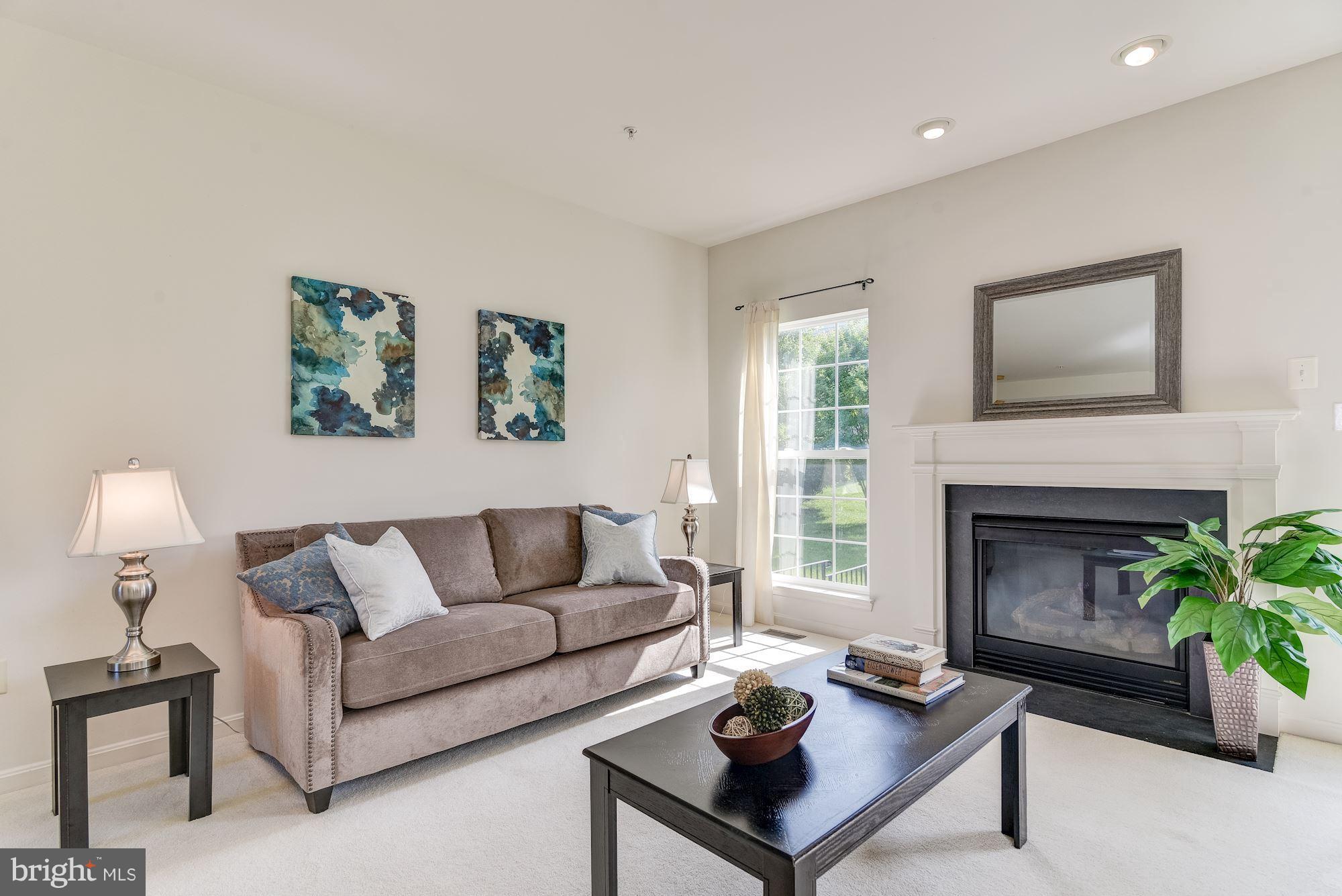 14629 Bubbling Spring Road Boyds, MD 20841 - Photo 7 of 30 a living room with furniture and a fireplace