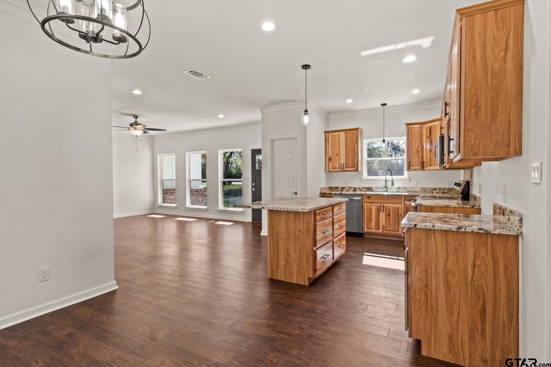 1339 Hwy 67 Mount Mount Vernon, TX 75457 - Photo 16 of 47 a large kitchen with stainless steel appliances kitchen island a large counter top and a wooden floors