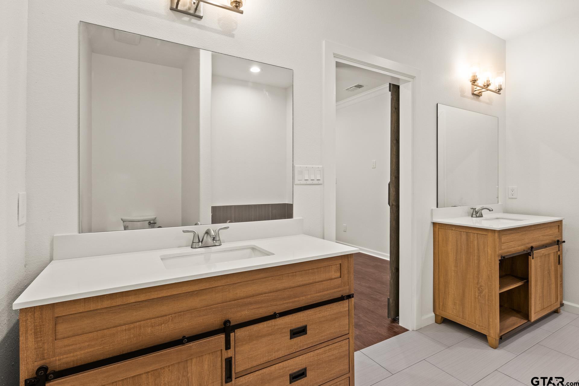 1339 Hwy 67 Mount Mount Vernon, TX 75457 - Photo 23 of 47 a bathroom with a sink double vanity and a mirror