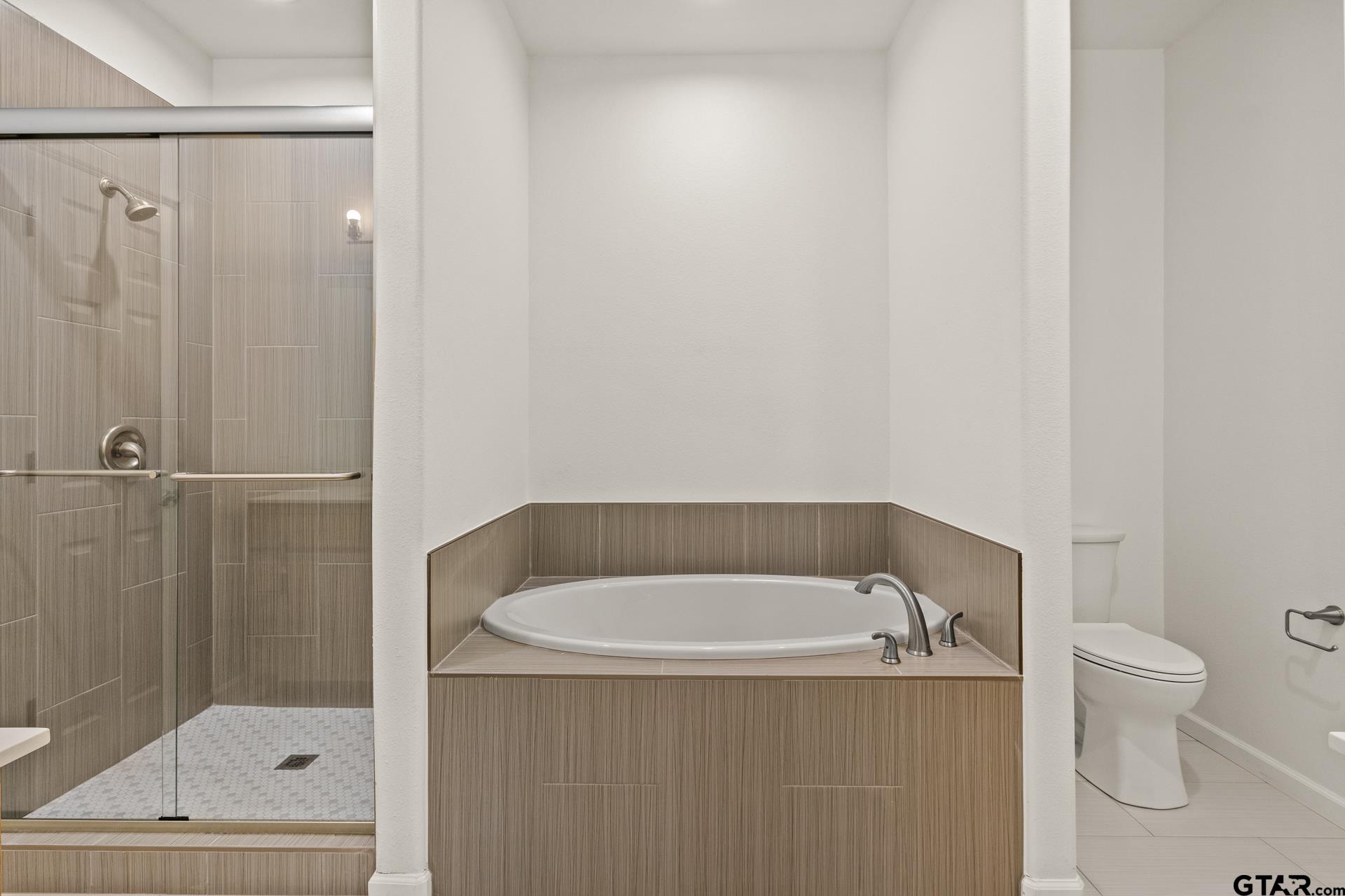 1339 Hwy 67 Mount Mount Vernon, TX 75457 - Photo 24 of 47 a bathroom with a tub and toilet