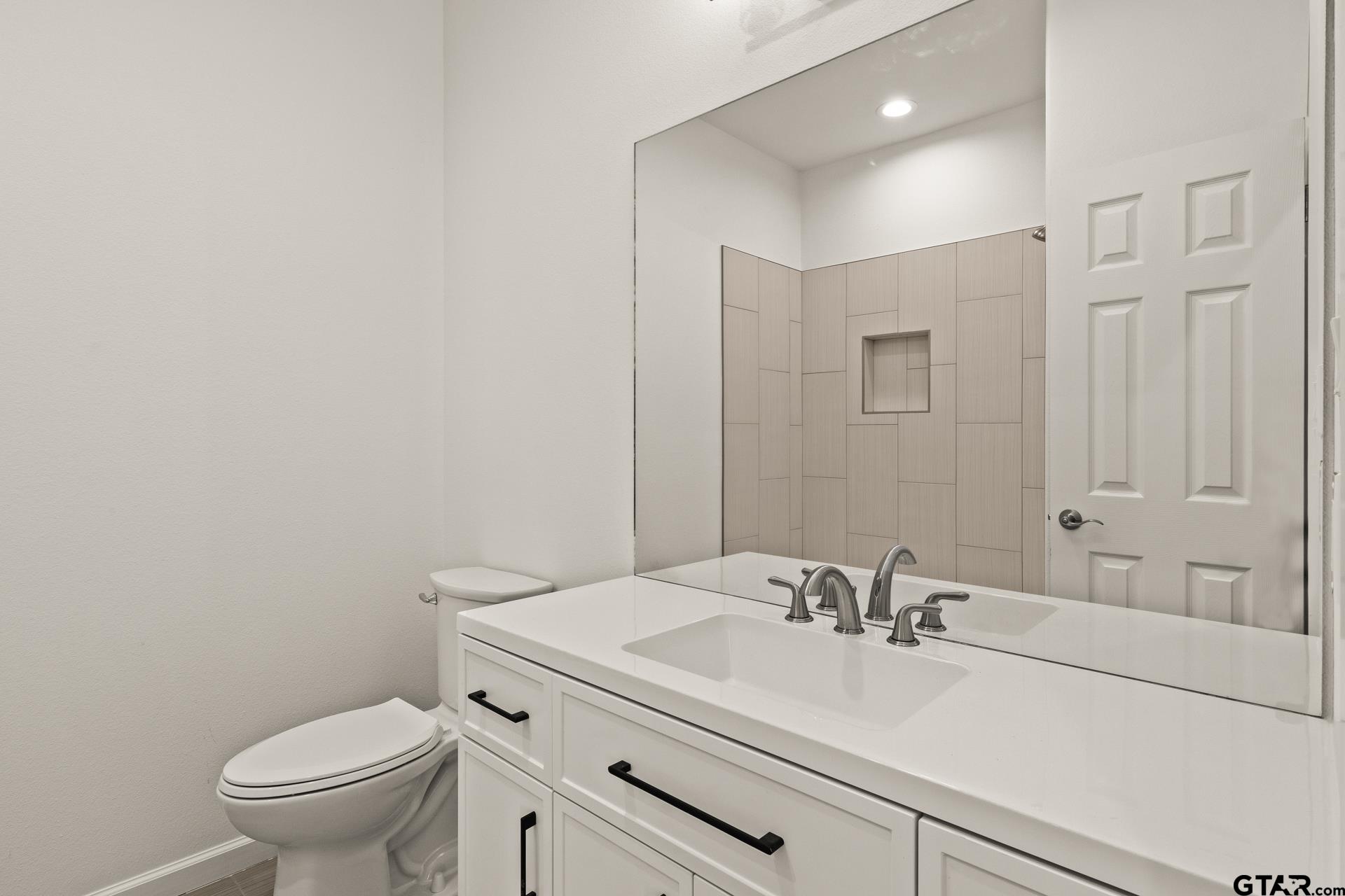 1339 Hwy 67 Mount Mount Vernon, TX 75457 - Photo 29 of 47 a bathroom with a sink a toilet and a mirror